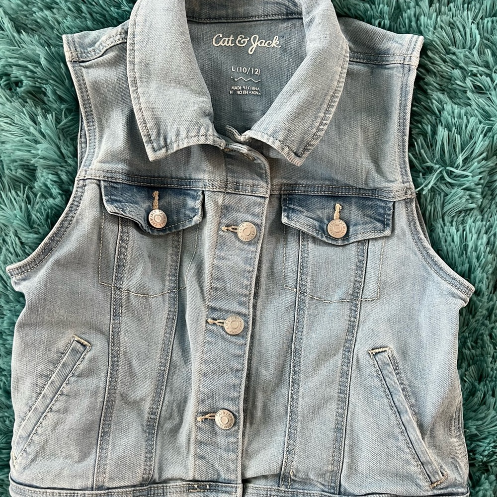 Distressed denim vest